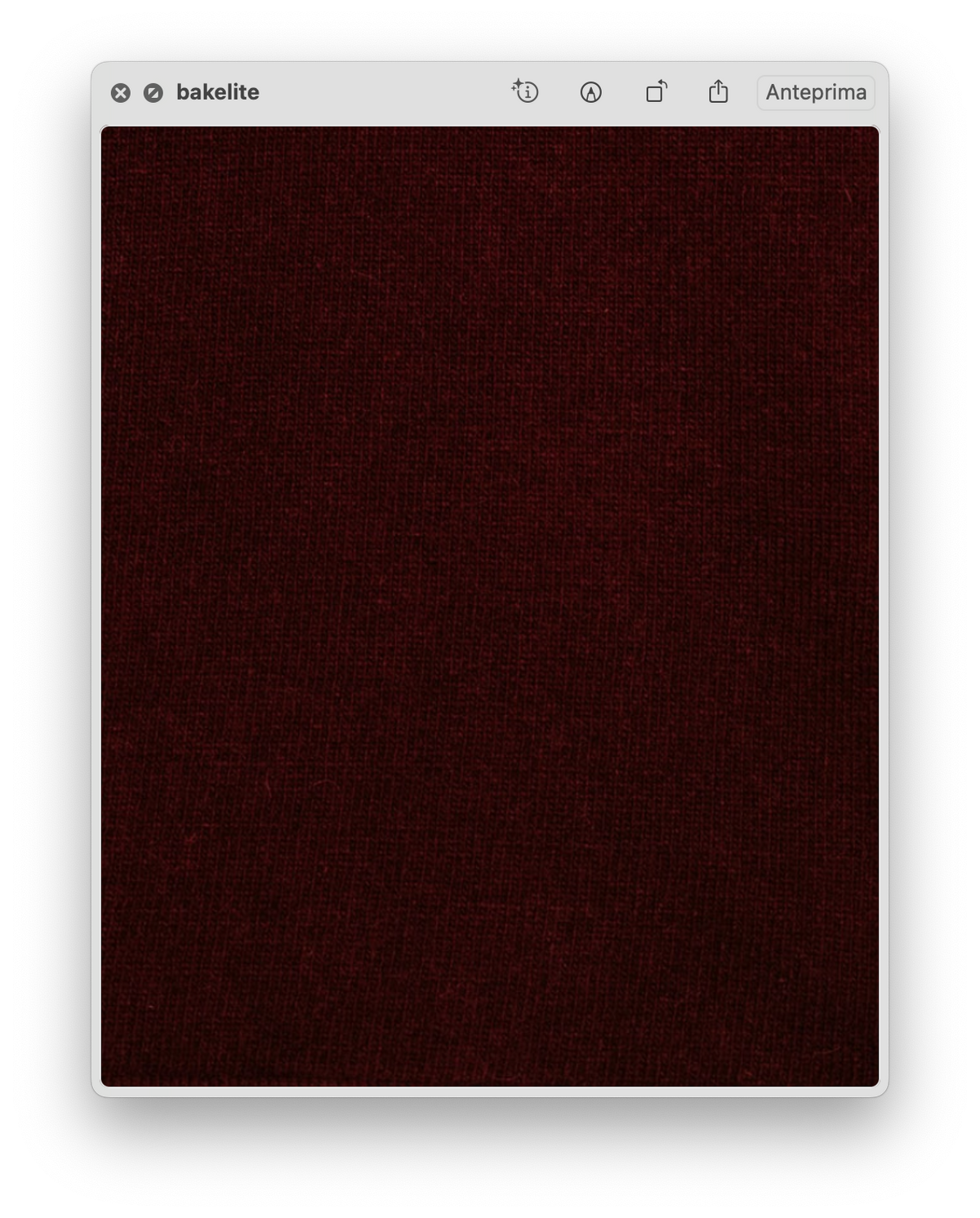 Close up of deep burgundy knit fabric texture.
