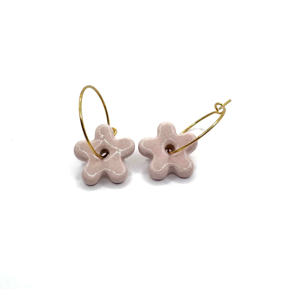 Pink floral ceramic flower earrings with thin gold hoops on a white background