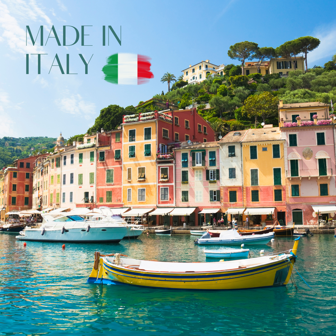 Colorful Italian seaside village with boats in the harbor and a Made in Italy brushstroke flag.