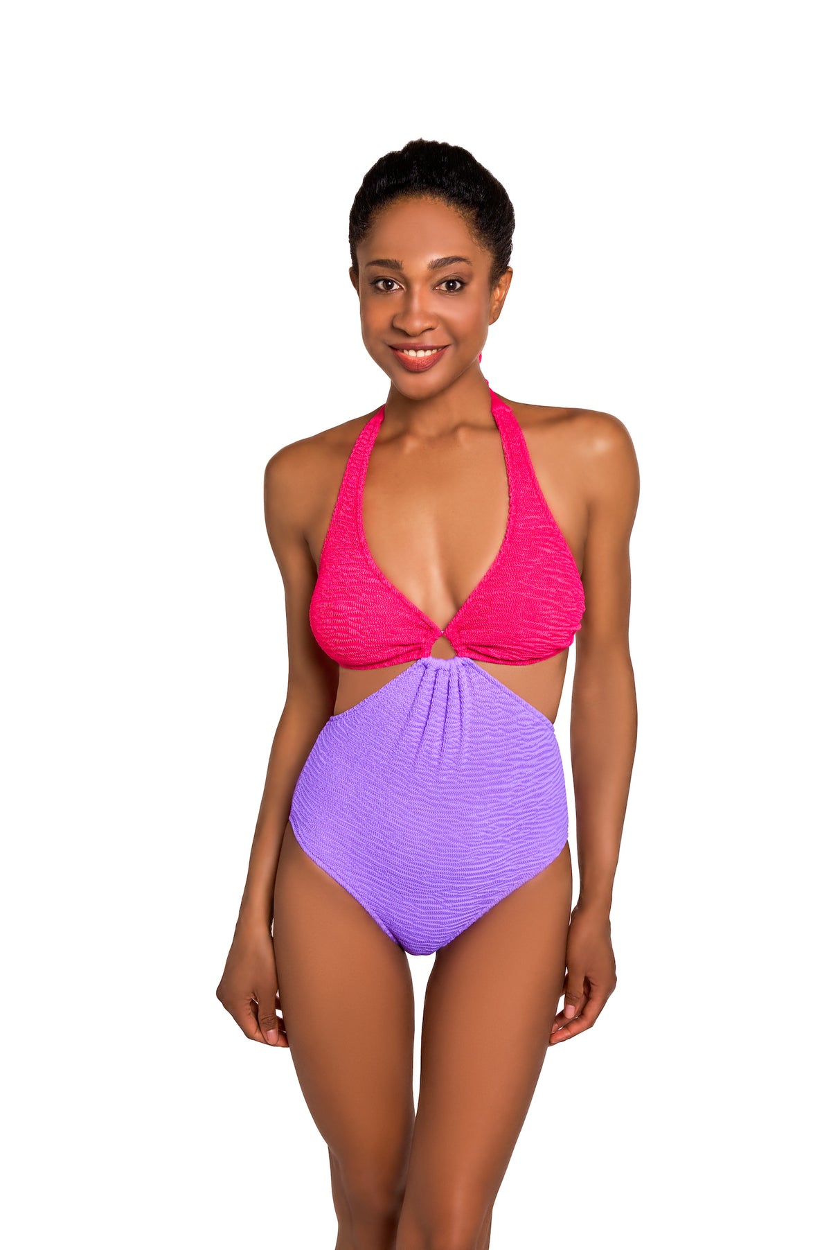 Woman wearing a pink and purple swimsuit on a white background