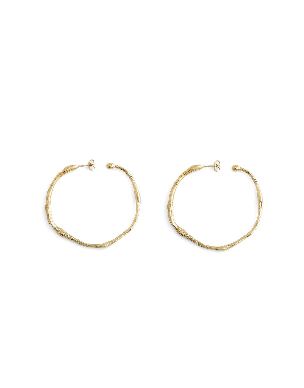 Gold hoop earrings on a white background