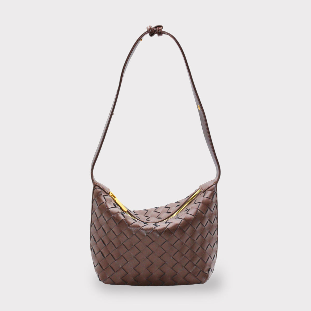 Genuine leather woven brown shoulder bag with a gold zipper closure.