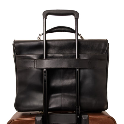 Mate black leather laptop briefcase mounted on a rolling suitcase with an extended telescoping handle