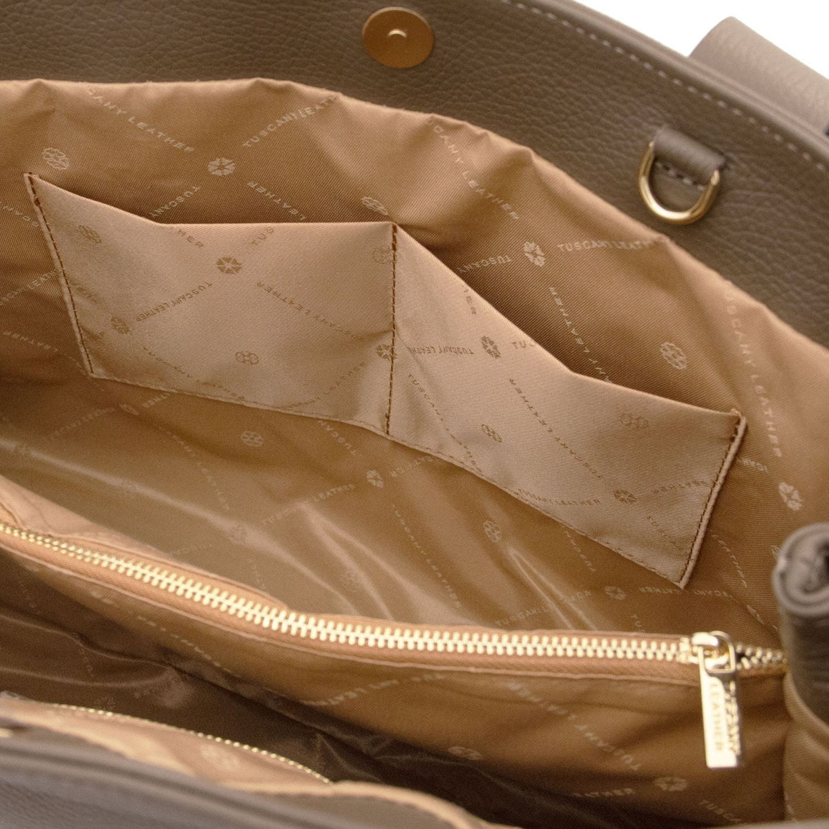 Inside view of Callie soft leather shoulder bag showing stitched pockets and a zip compartment