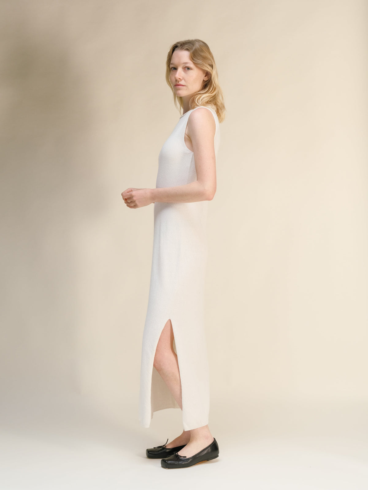 Blanco cashmere blend boat neck sleeveless maxi dress shown in profile on a model