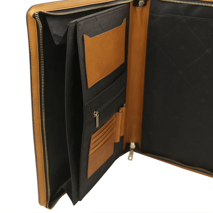Open leather document case with tan trim and black lining showing card pockets and a zip pocket