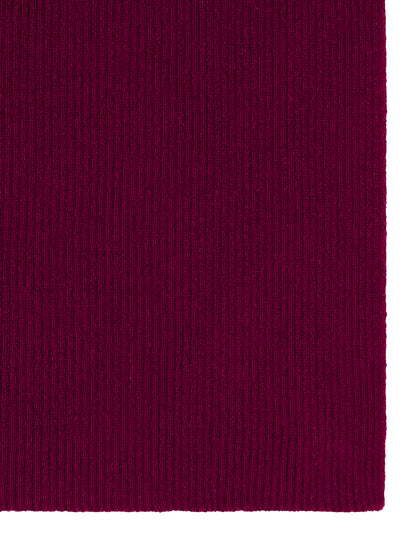 Primo piano di texture in maglia a coste magenta intenso