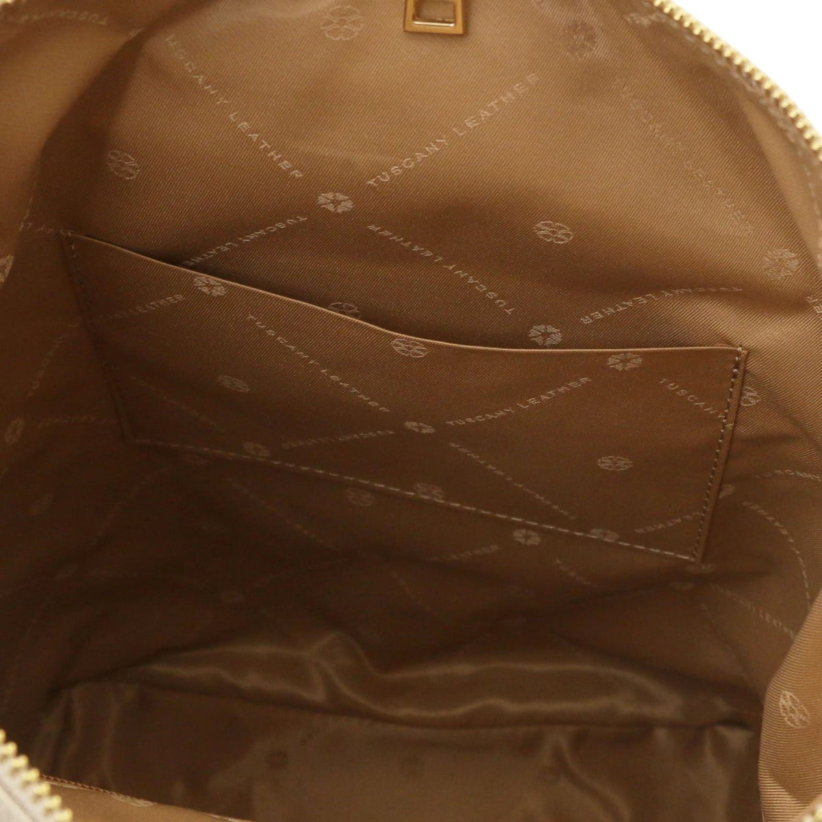 Vista interna of Dublin Soft Italian leather backpack con marrone lining e a tasca aperta.