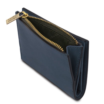 Blu portafoglio in pelle partially open che mostra scomparti interni e zip color oro