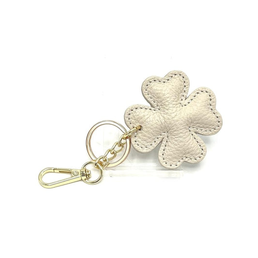Beige Italian leather four-leaf clover keyring and bag charm with gold hardware