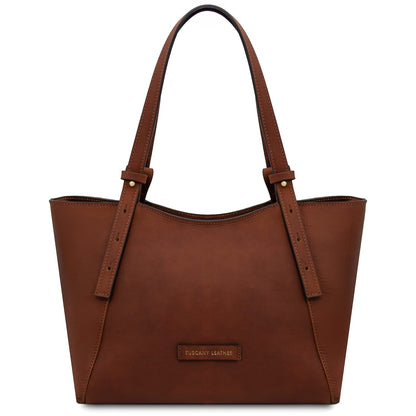Front view of Libra brown leather tote with long straps and small brand plaque