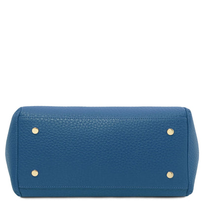 Blue Libra long handle leather tote seen from bottom with gold-tone studs