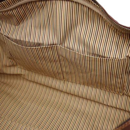 Vista interior highlighting a stitched pocket and striped lining.