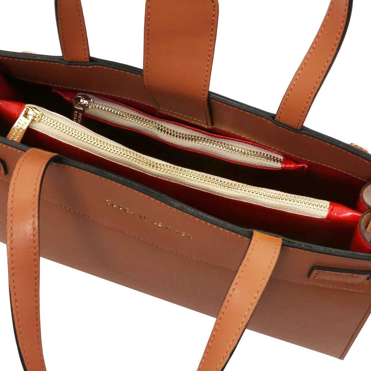 Interior of Musa Italian leather handbag with red lining and gold zippers