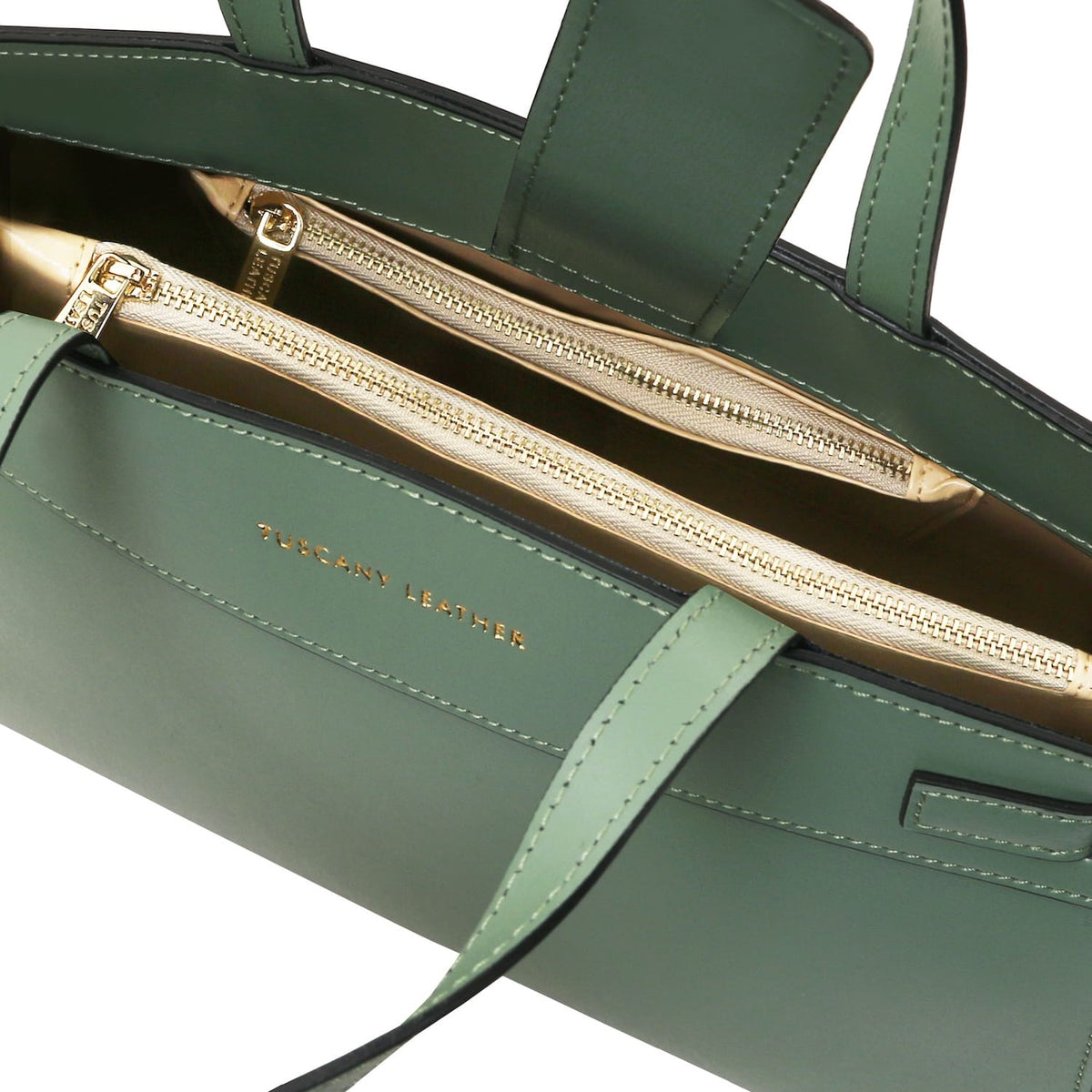 Green Musa Italian leather handbag with gold zippers and beige interior showing two zip compartments.