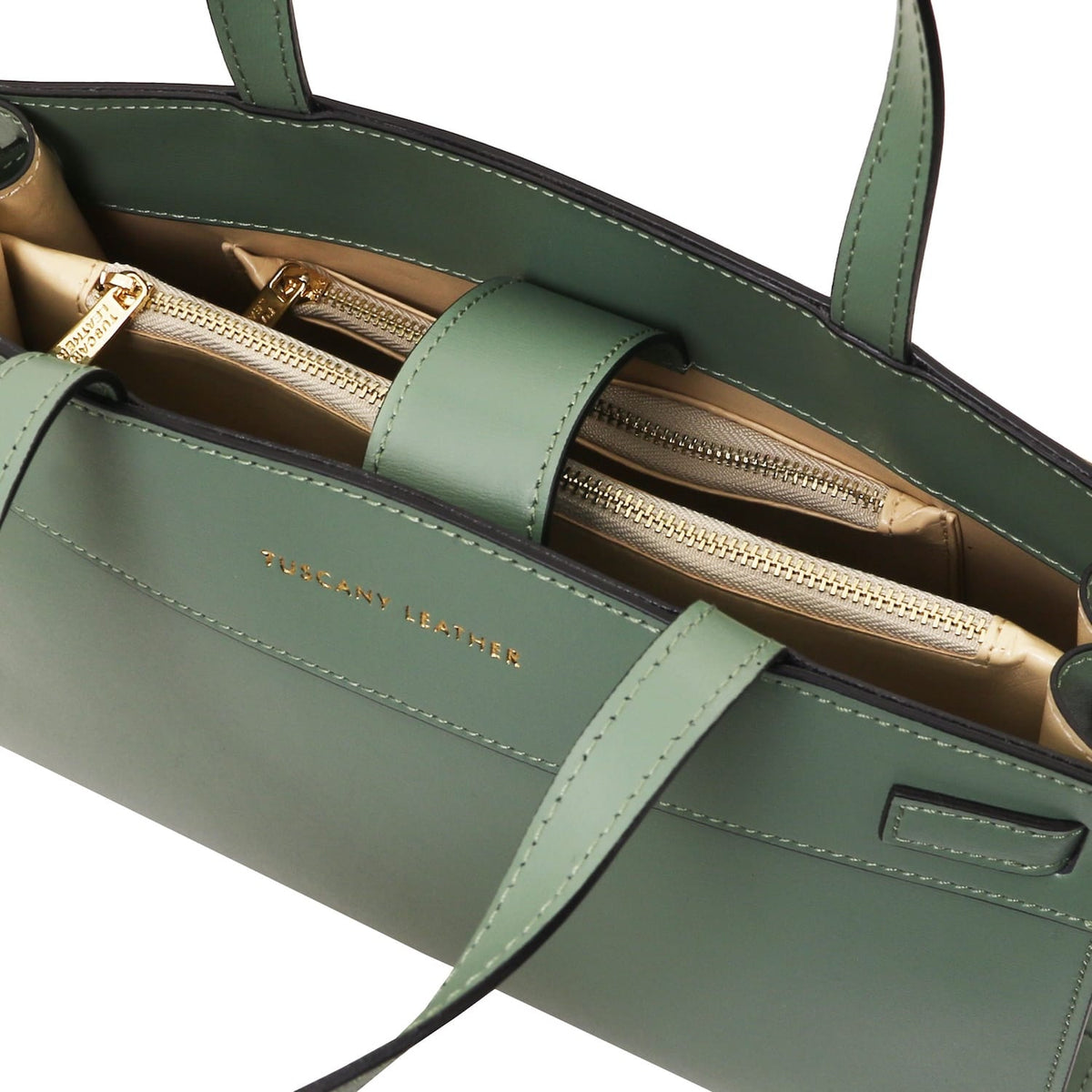 Green leather handbag with gold zipper on a white background