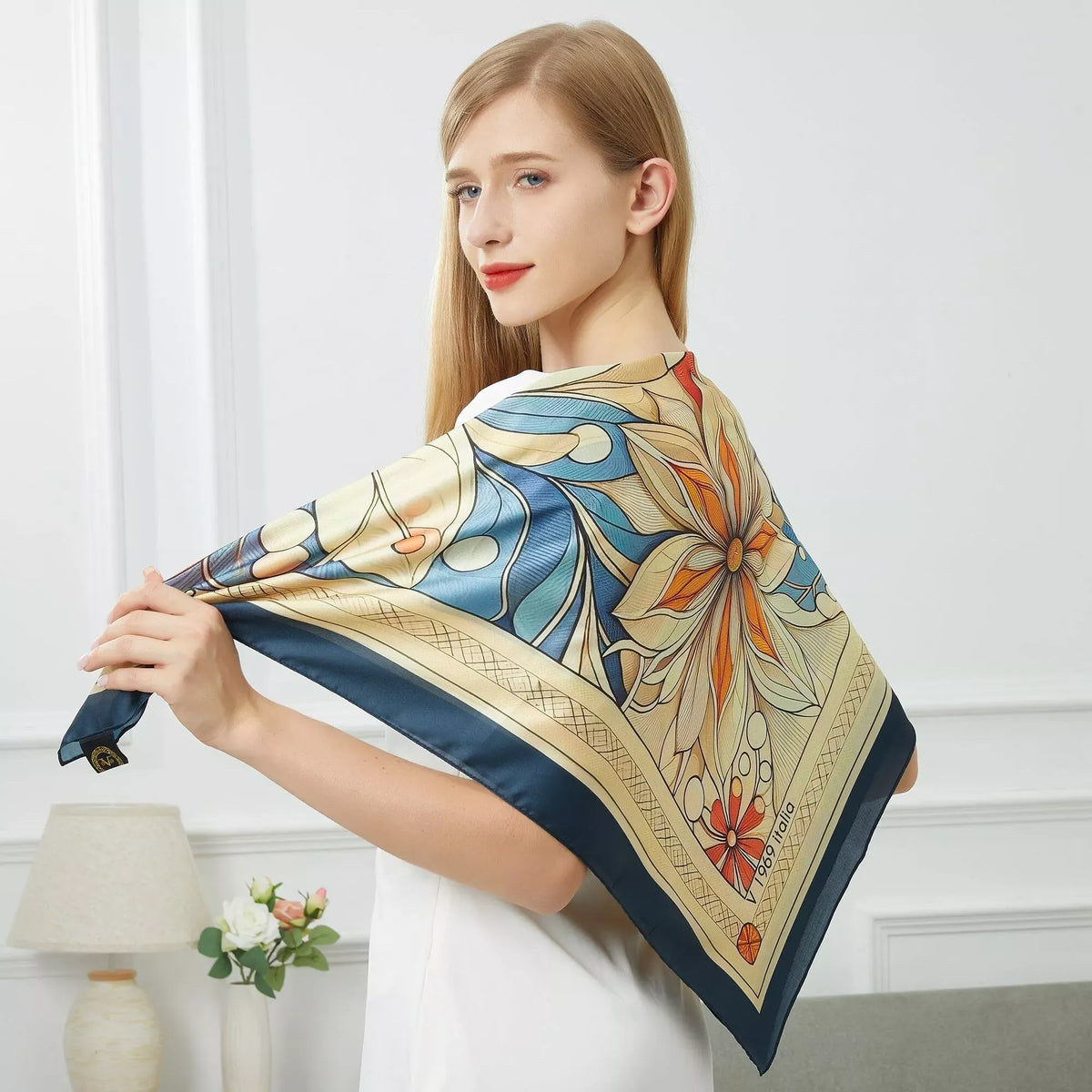 Mystic Flowers Large Square Silk Scarf (90 × 90 cm) featuring intricate floral and leaf patterns in blue, orange, and cream tones.