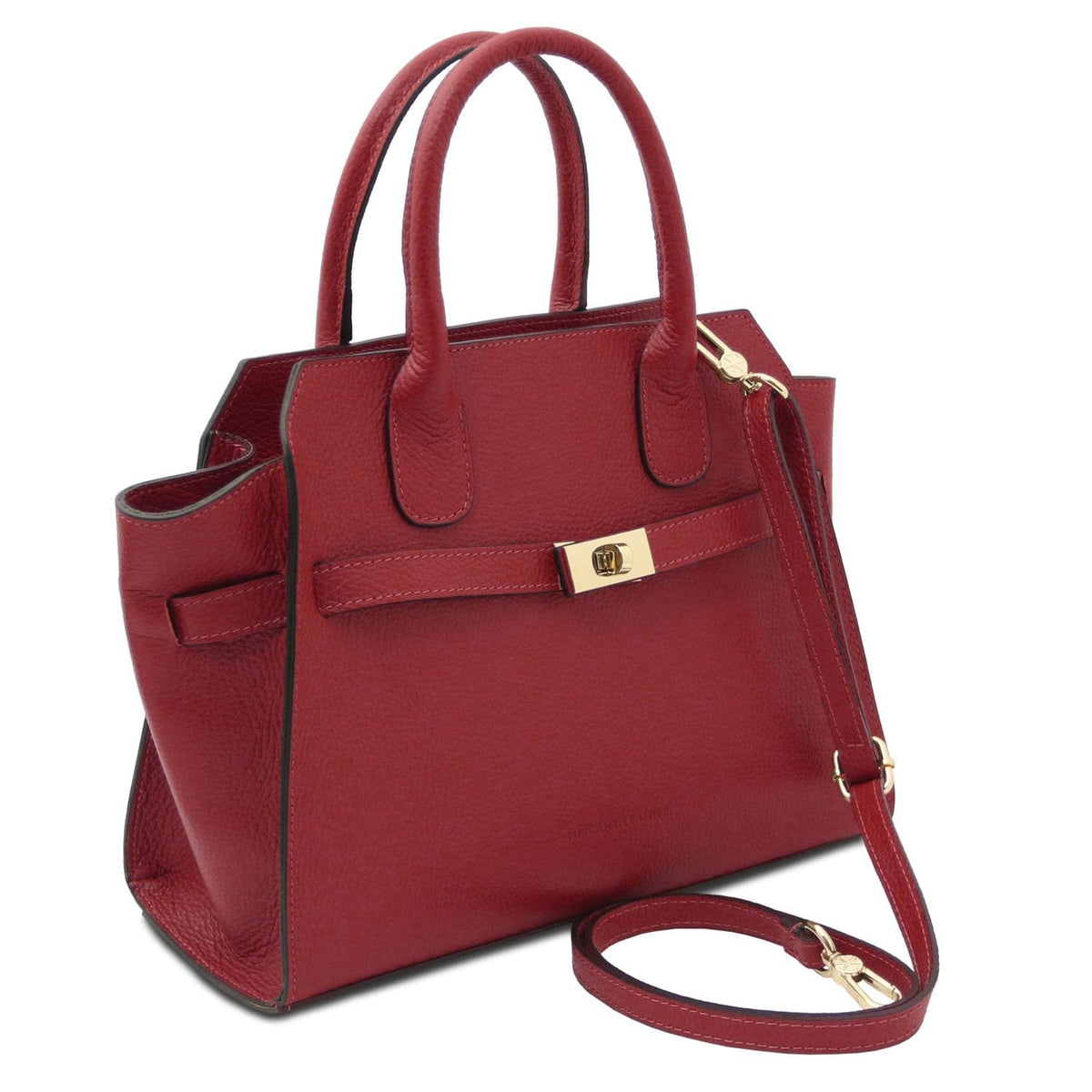 Red leather tote with two top handles, front strap with gold turnlock, and a detachable shoulder strap.