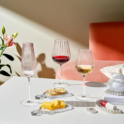 Dusty rose sparkling wine glasses set of two on a white table