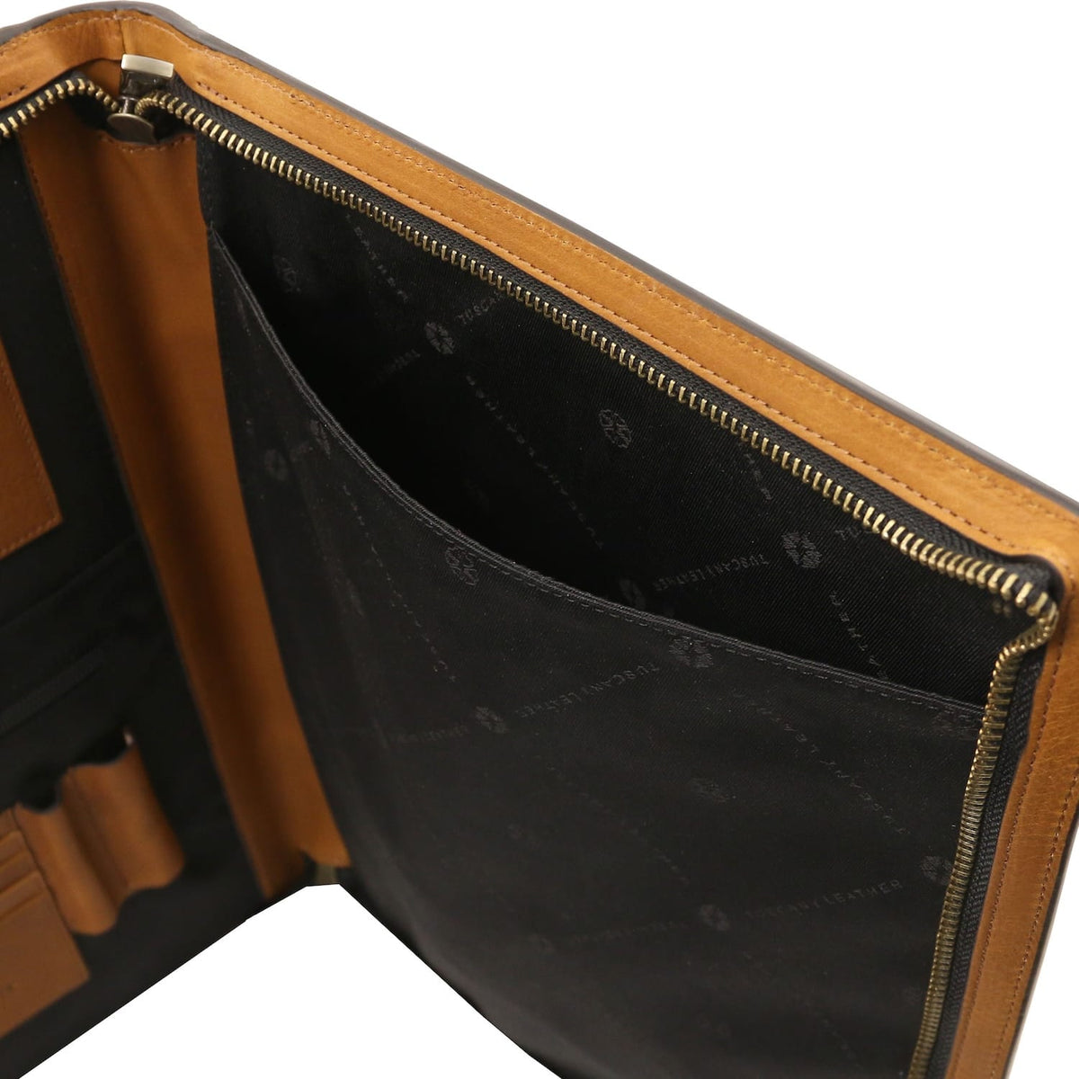 Top view of the interior with tan leather trim along the zipper and black lining