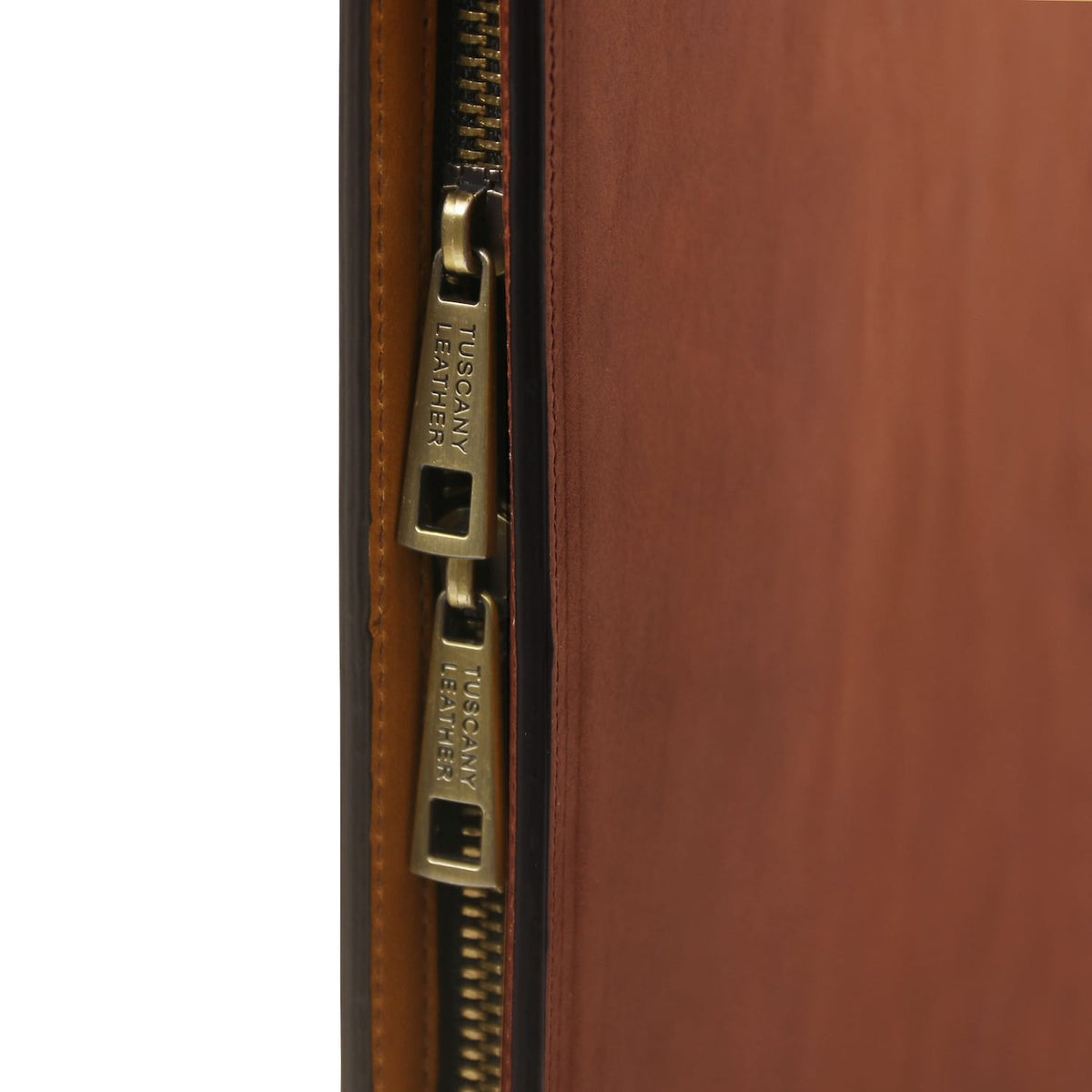 Close up of brass zipper on brown leather Tiberio document case