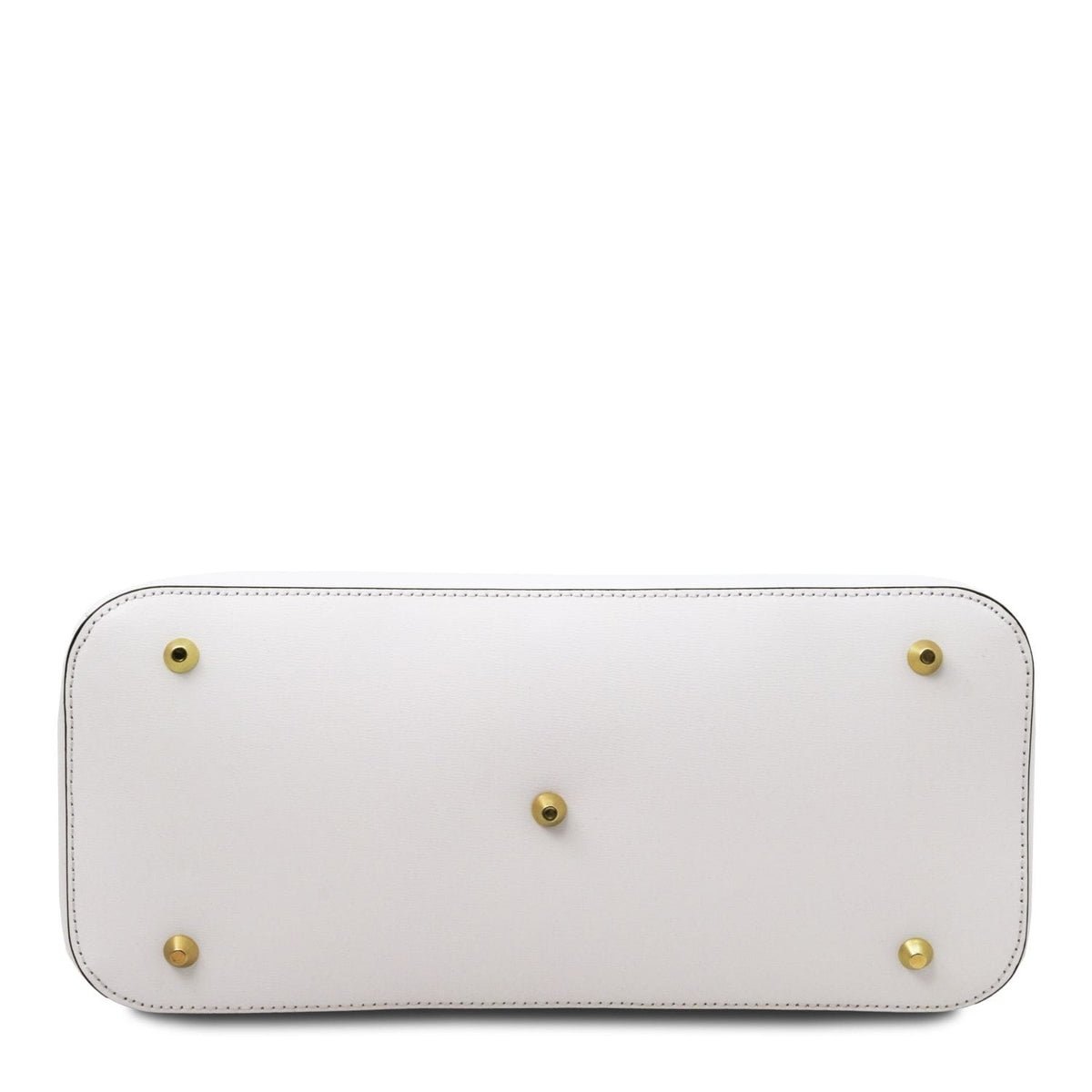 Bottom view of a white leather handbag with five brass protective feet and detailed stitching along the edges.