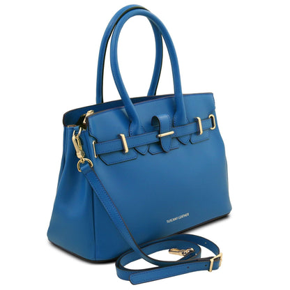 Blue full-grain leather handbag with dual top handles, detachable shoulder strap, and gold-tone metal buckle accents.