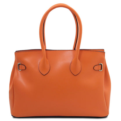 Orange smooth leather handbag with double handles and minimal metal hardware accents in a structured silhouette.