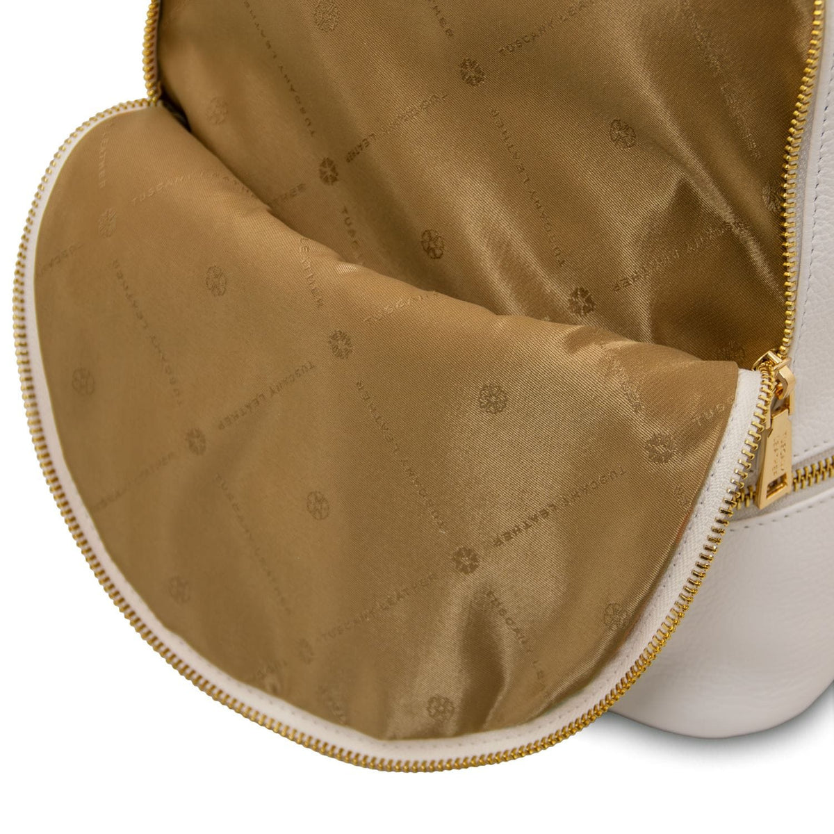 Tan interior lining with subtle logo pattern and gold zipper of the TL Bag soft leather backpack