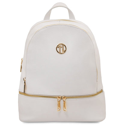 Cream white soft leather backpack with gold-tone zippers and a round gold logo plaque on the front.