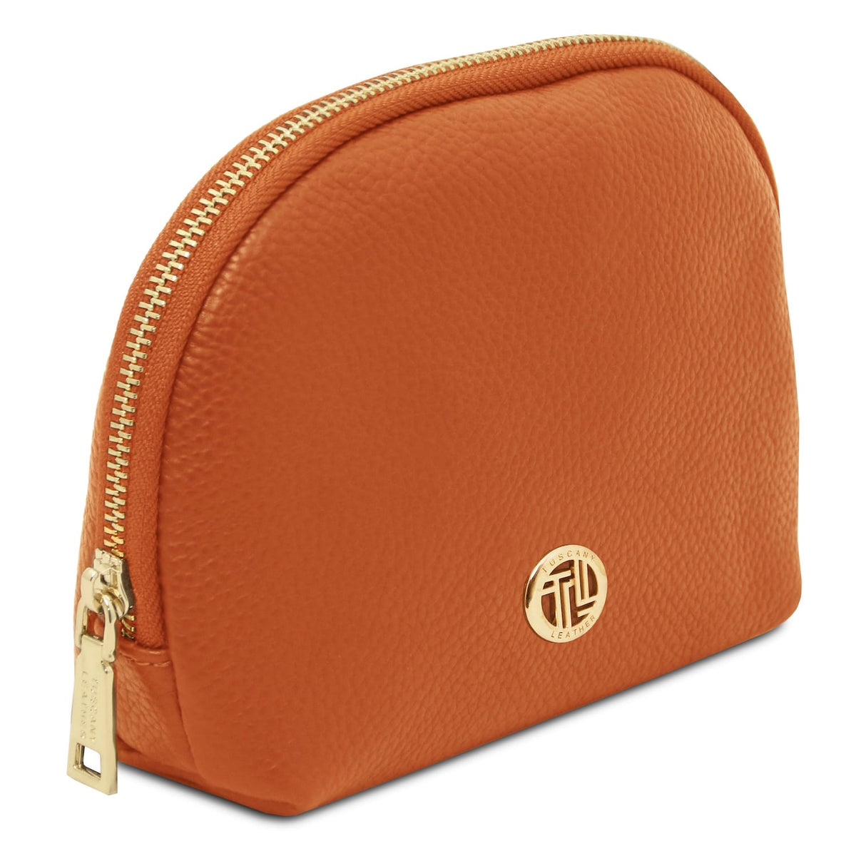 Soft texturosso Italian leather toiletry case in warm cuoio con gold-tone zipper e round metal emblem detail.