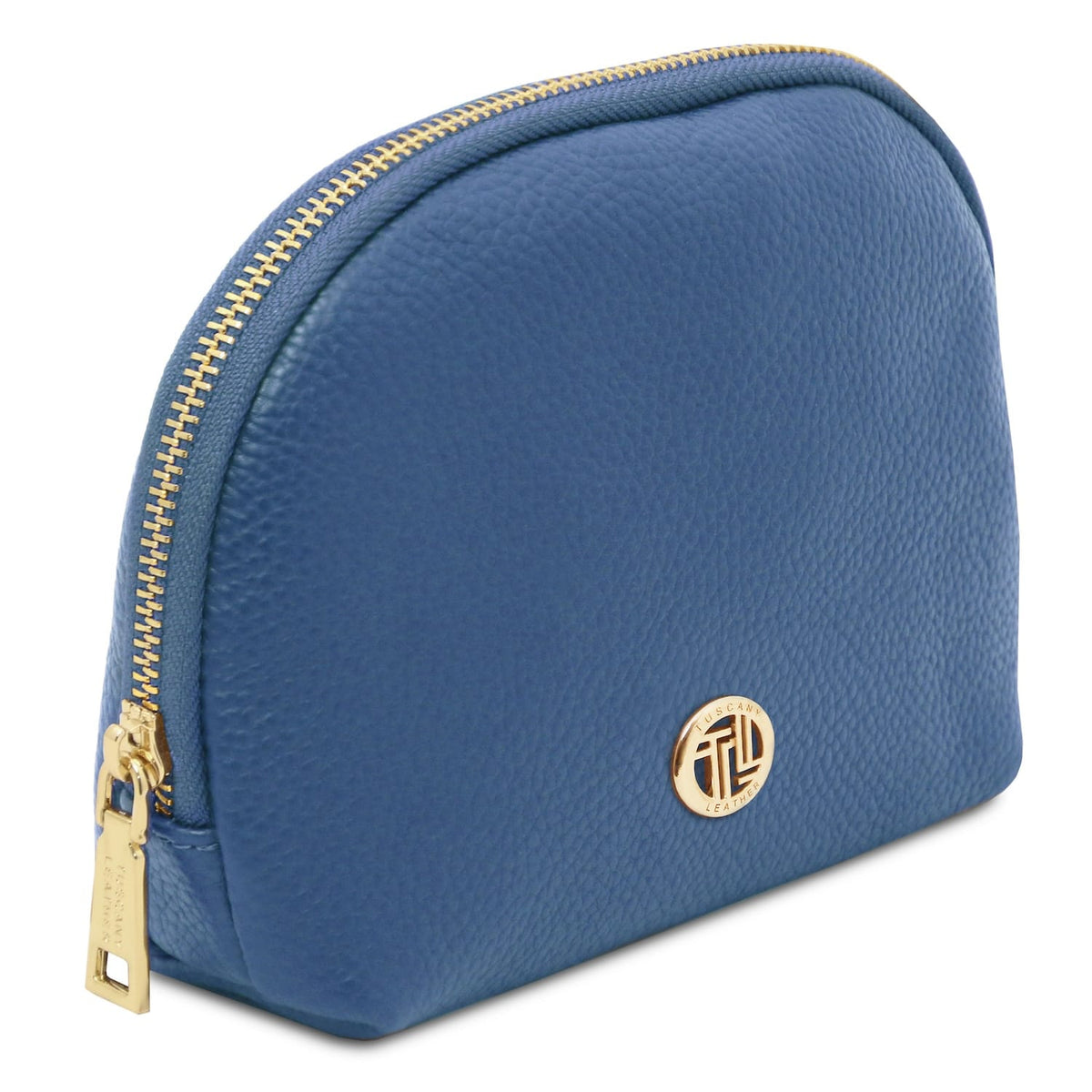 Blu pelle morbida toiletry case con gold-tone zipper e round metal emblem on pebbled Italian leather surface.